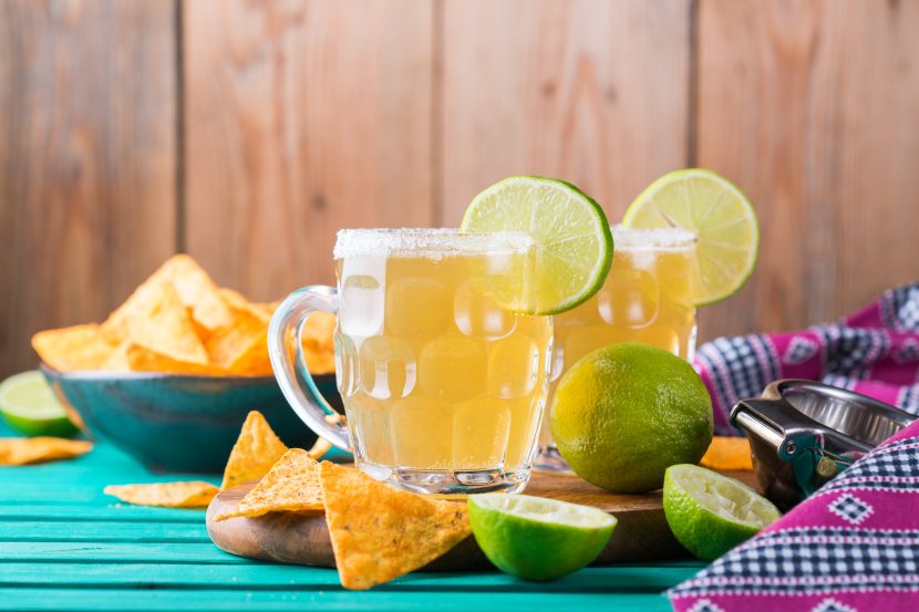 Mexican alcohol cocktail chelada with light beer and lime juice